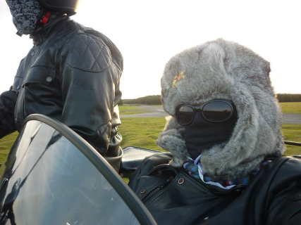 Beth warding off the chilly breeze in a sidecar! ;) its cold.bmp